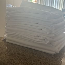 9 White Table Covers 
