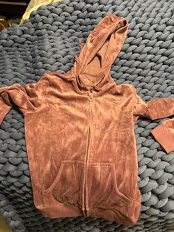 Velour zip-up vest with attached hood. Front kangaroo pockets.