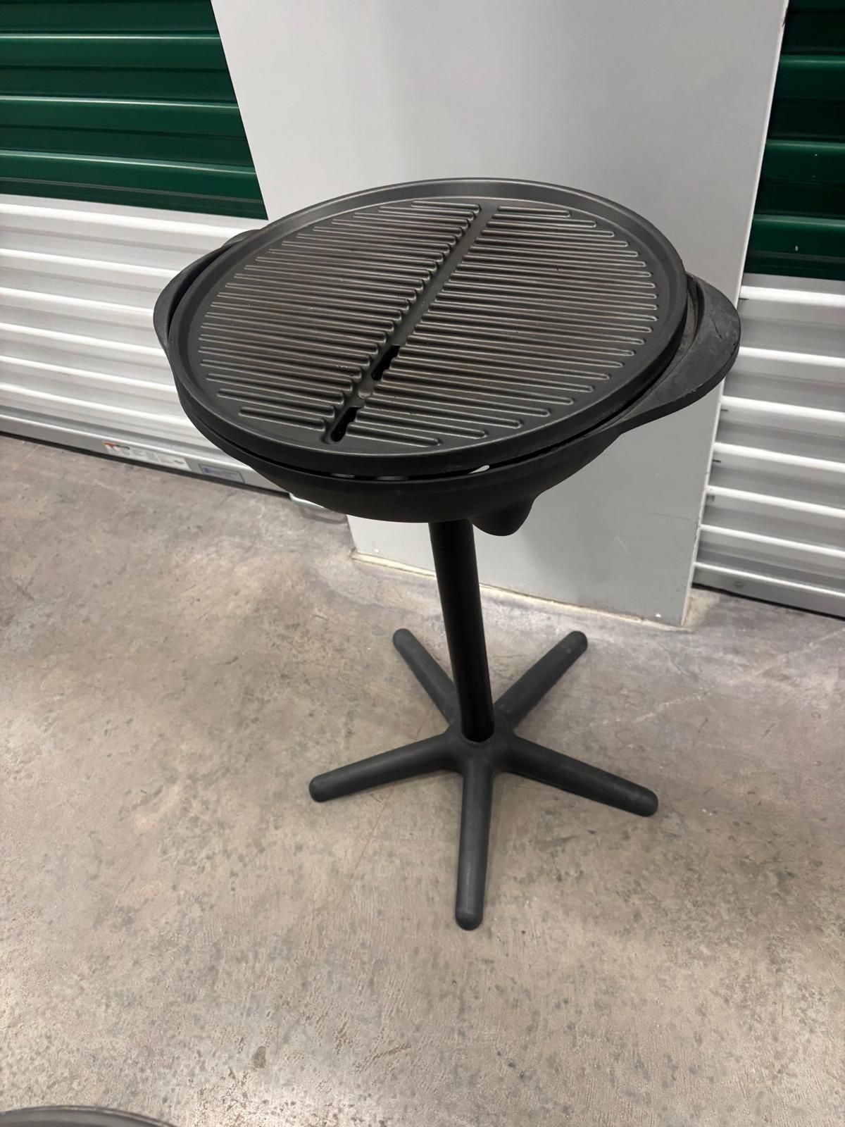 George Foreman standing outdoor, electric grill… $50