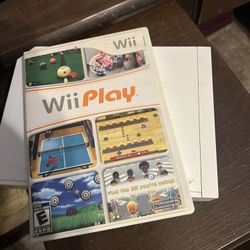 Wii Console, Game Disc, Cables, Remotes and Dance Pad.  