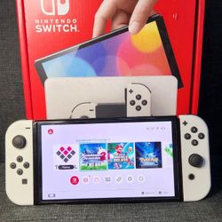 NINTENDO SWITCH OLED with 125 SWITCH GAMES and 7500 RETRO CLASSIC GAMES