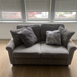 2-seater grey sleeper sofa 