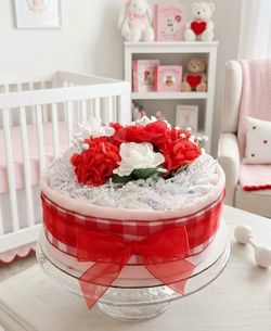 New red and white baby girl diaper cake