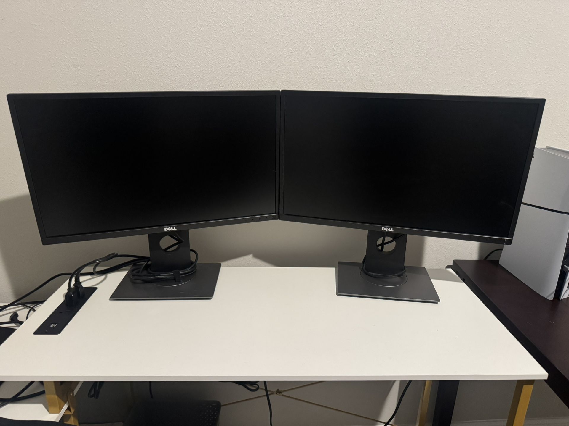 2 Dell Monitors With Docking Stations And Stands.