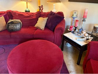 Pretty red couch with matching oversized chair and ottoman