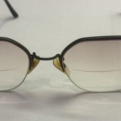 Vintage Reading Glasses Brown Rims Bottom of Lenses are Magnified Top is not.