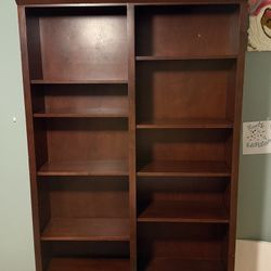 Wooden bookshelf with adjustable shelves