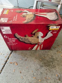 Brand new 6 ft. Polar Wishes LED Angel with Star yard sculpture.