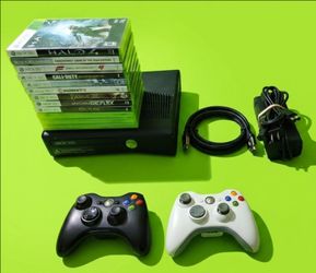 Microsoft Xbox 360 slim with 2 controllers 12 games HDMI cord power supply