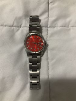 Authentic Rolex Stainless Steel Date Model. Full-size Bracelet . Oyster Perpetual. Red Diamond Dial . Read Ad. Firm Price 