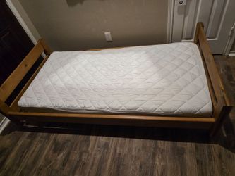 Twin bed on wheels with mattress