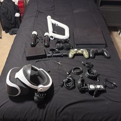 PS4 slim 1 terabyte PSVR and 2 vr controllers and aim gun controller 2 PlayStation 4 controllers G29 pedal and steering wheel 7 games