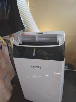 Air conditioning unit and a heater