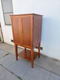 Solid wood armoire, 62.5"H  30.5"W.  26"D.