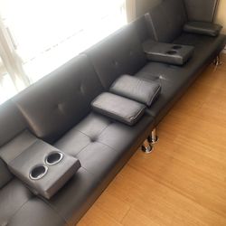 1 Black Futon With Cup Holders And 2 Pillows