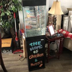 Upright, fishbowl tank, and stand cabinet opens up