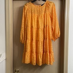 Adorable Women’s size small dress. Worn once. Yellow/orange color.  Completely lined 