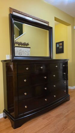 Clean and Nice Dark Brown 9 Drawer Dresser and Mirror.