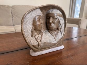 Carved Soapstone sculpture depicting Native Americans
