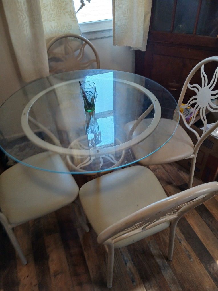 Metal Chairs . And Table . Moving