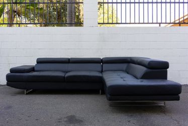 Modern black leather sectional sofa with chaise