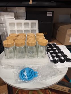 12-Piece Glass Spice Jar Set (with labels), 4 oz (approx. 120 ml) capacity, featuring bamboo lids Includes labels, a funnel, spare shaker inserts, and