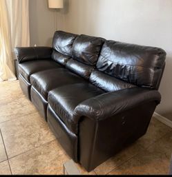 Black Leather Reclining Sofa .Price Including Delivery 
