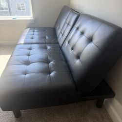  Benzara Berie Futon Sofa Bed, Drop-Down Tray, Cupholder, Black Faux Leather. Urgent sale due to movi