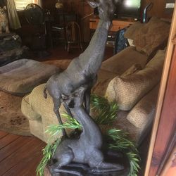 Giraffe statue with baby