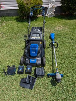 Kobalt 21-in brushless 80 volt self-propelled lawn mower with bagger.  2- 80 volt batteries and two chargers and kobalt 80 volt weed eater. All are in