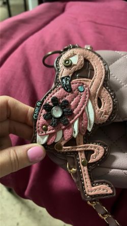 Purse with cute bird accessory