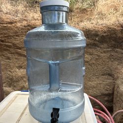 5 gallon water jug with spigot and wide mouth top.  Great condition!