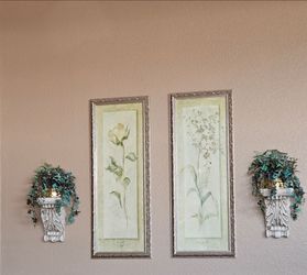 Two floral pictures with two stone sconces