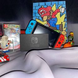 Nintendo Switch with two games and accessories