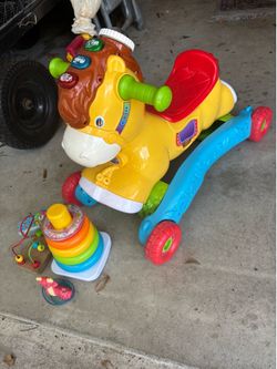 Infant  horse walker and toys