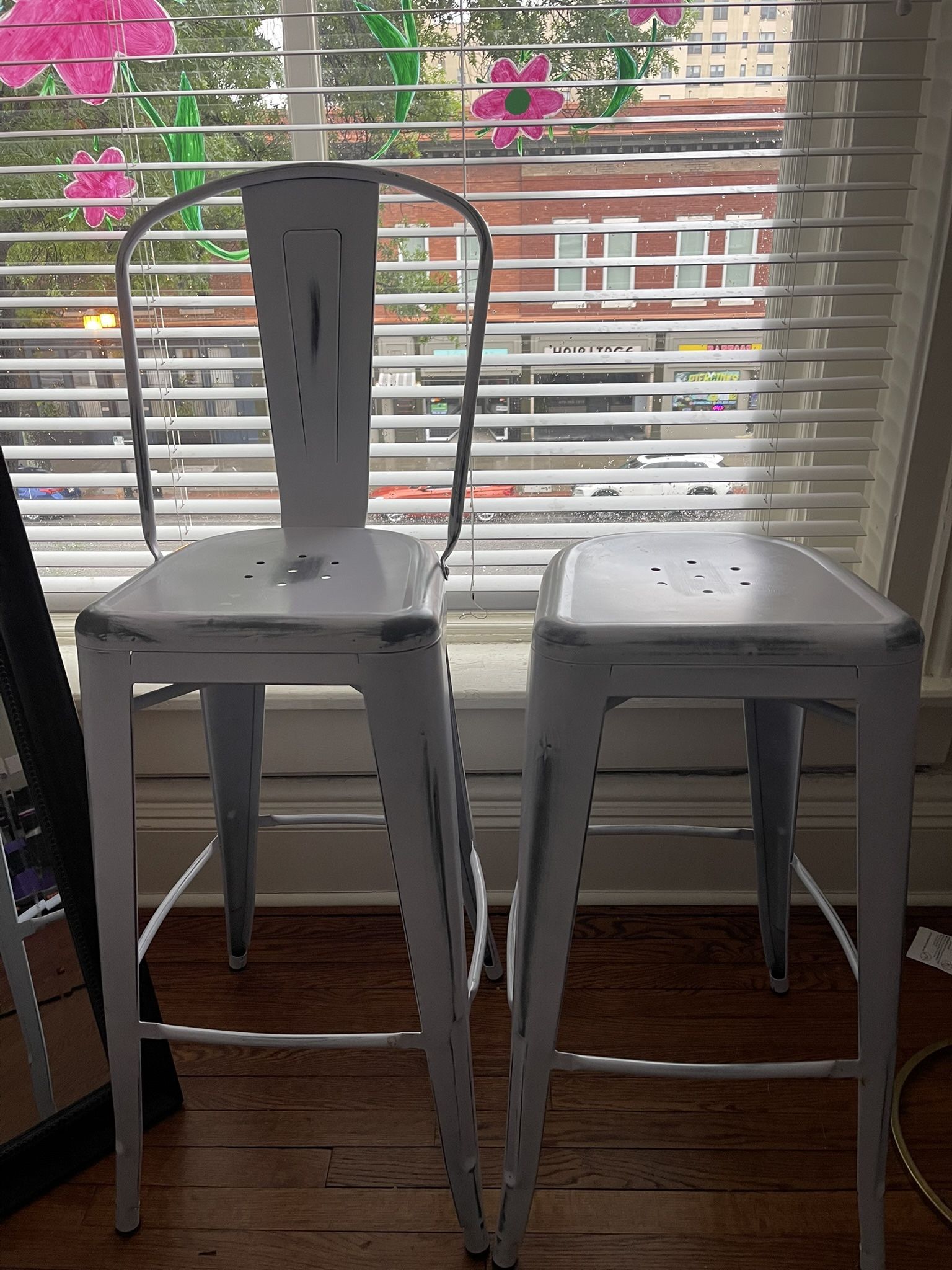 Three Distressed White Metal Bar Stools