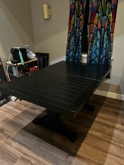 Black dining table and leaf extension