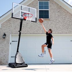 Spalding 54 inch Shatter-proof Polycarbonate Exacta Height® Portable Basketball Hoop System