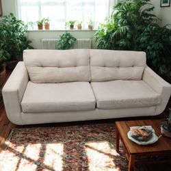 Fabric Par Beige Couch And Rug
