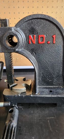 One-ton press with three-piece riveting