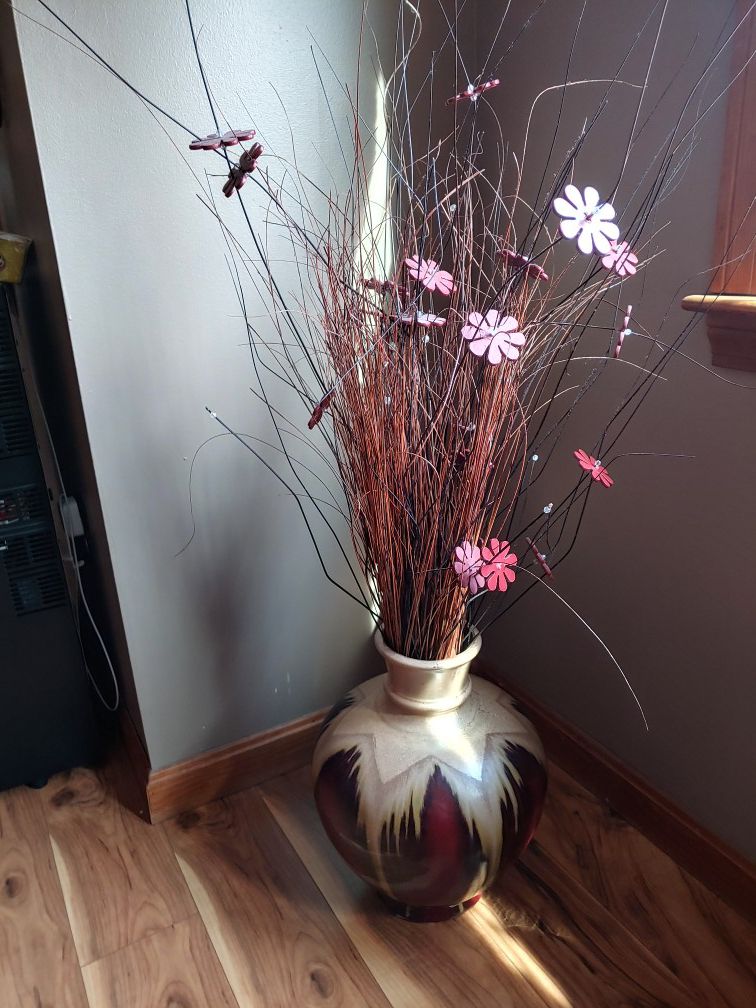 Brown vase with burgundy flowers