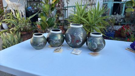 Kokopelli pottery jars