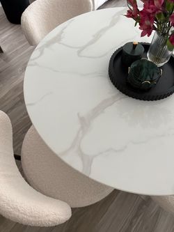 Dining table marble like top set with cloud boucle chairs