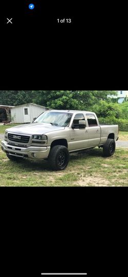 99-06 Sierra Black Housing Headlight Set