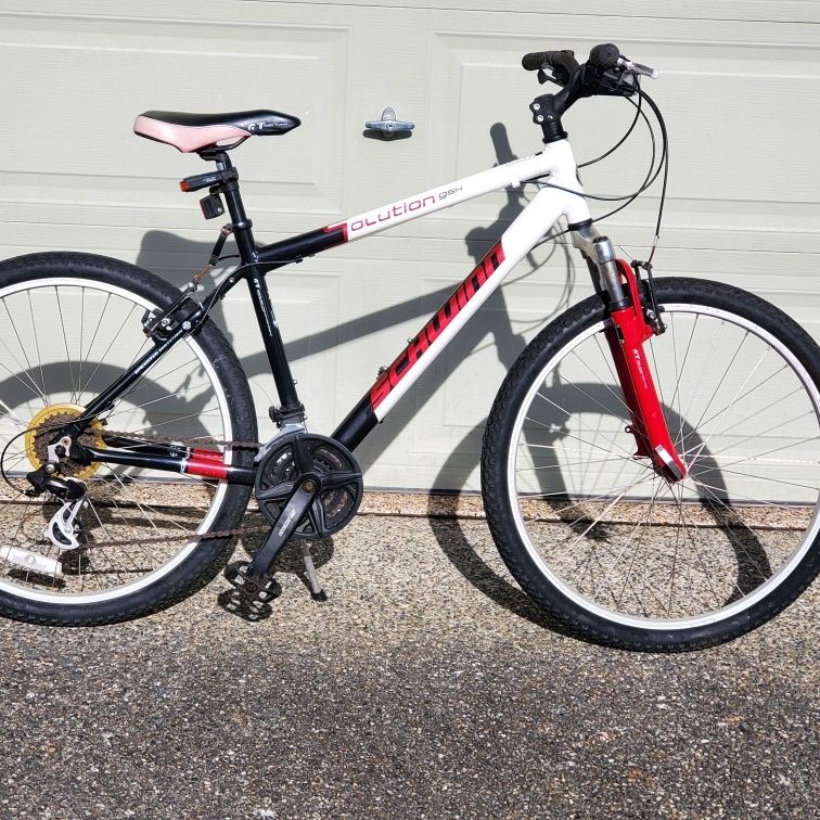 schwinn solution bicycle Suburban Hybrid Bike, 26 Inch Mens and Womens Bike, 7-Speed Hybrid Bicycle, Front and Rear Linear Pull Brakes, Ergonomic Grips, Comfort Frame, Large Cushioned Seat, Fenders, Adult and smooth belt drive Schwinn GSX Solution 26" Mountain