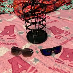 Two Sunglasses , A Necklace,And A Jewelry Holder