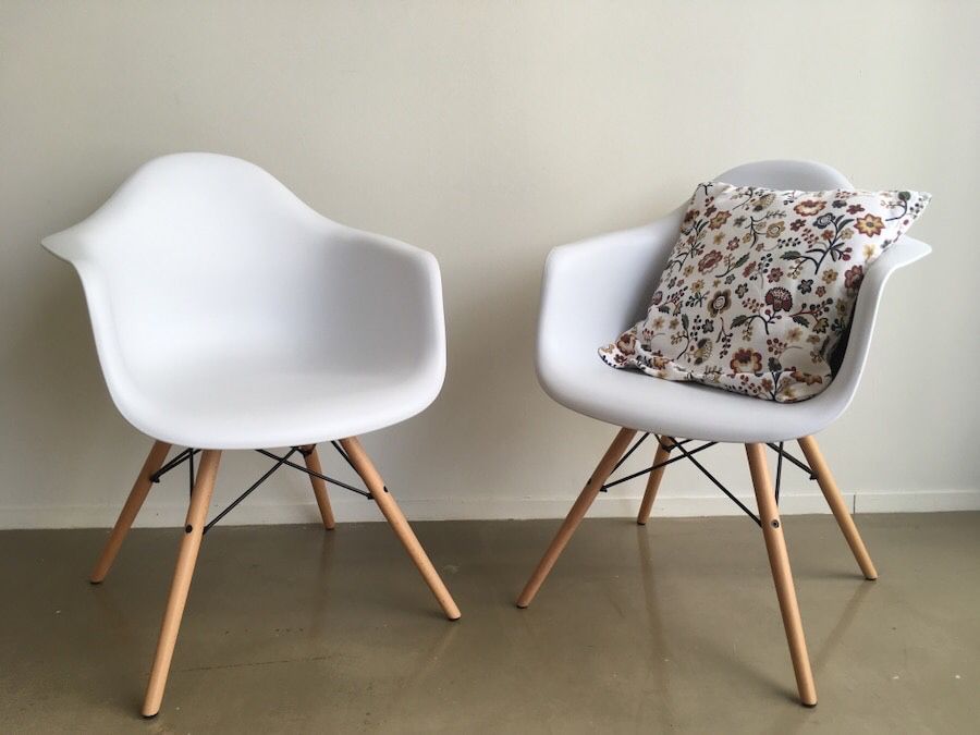 Two white designer chairs