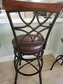 Wrought iron bar stools. Two Stools For $25 Each , Need To Be Recovered 