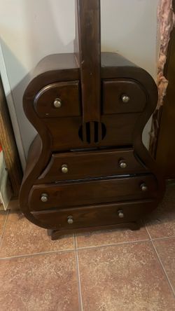Cello shaped furniture with drawers