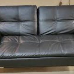 Futon - Black Faux Leather Converts  to a sleeper - Excellent Condition 